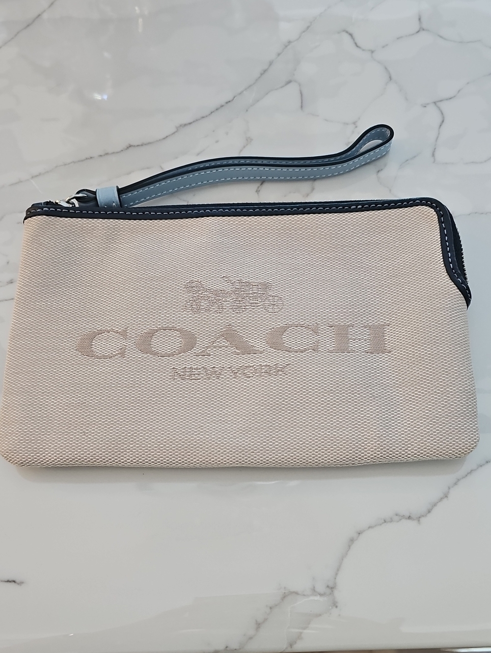 Coach Cream Canvas Wristlet with Navy Trim and Light Blue Strap